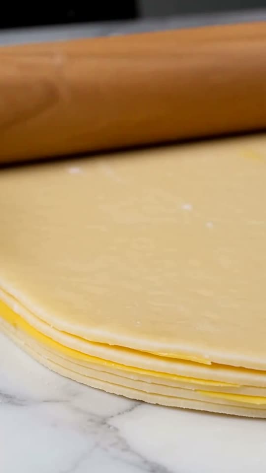 Step 3: Laminate with Double & Single Folds: On a lightly floured counter, roll the sealed dough block steadily away from you in