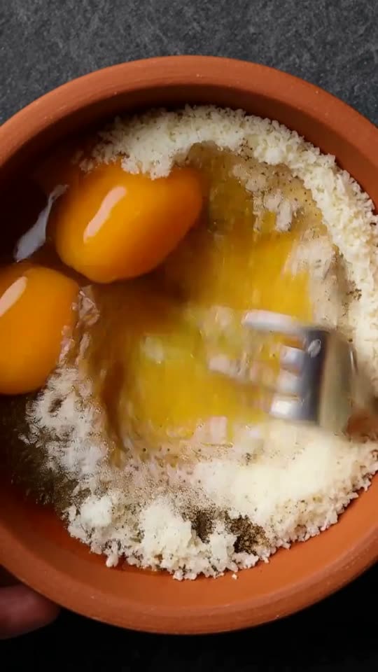 Step 3: Whisk the Carbocrema Paste: In a room-temperature mixing bowl, whisk the egg yolks, whole egg, grated Pecorino Romano, a