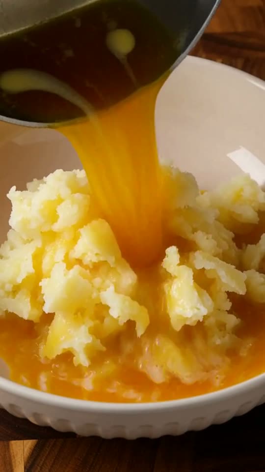 Step 5: Pass hot Yukon Gold potatoes through a fine ricer, whipping with nutty brown butter and warm heavy cream into an ultra-v