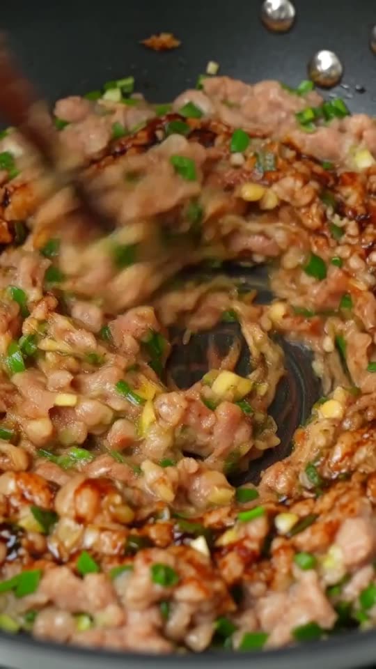 Step 1: Whip the Juicy Pork & Chive Filling: In a wide mixing bowl, combine 300g ground pork belly (at least 25% fat), 80g finel