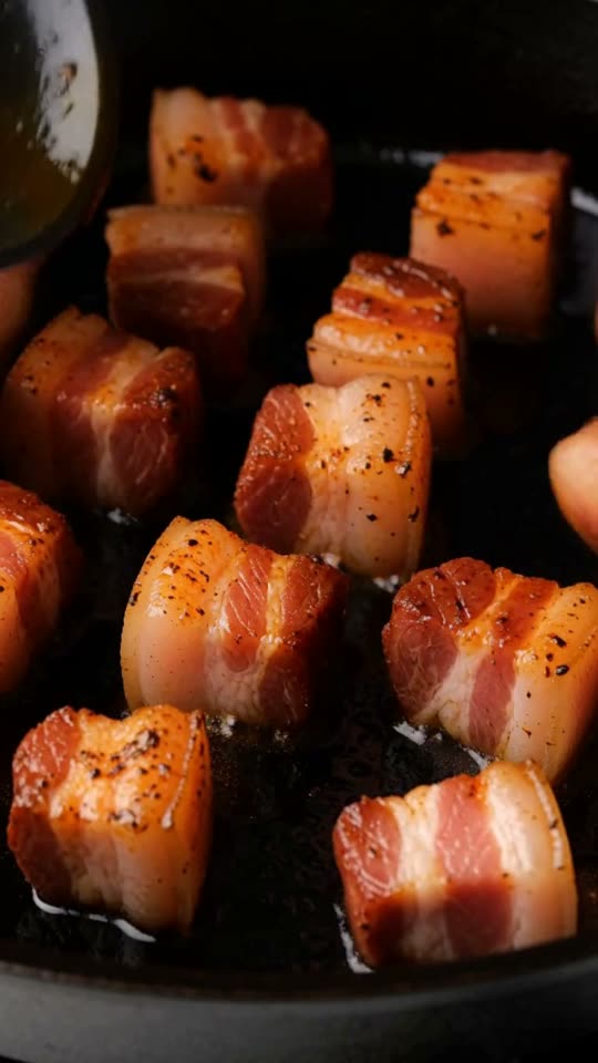 Step 3: Slow-Render in a Cold Cast-Iron Skillet: Arrange the pork belly cubes fat-side down in a single uncrowded layer in a col