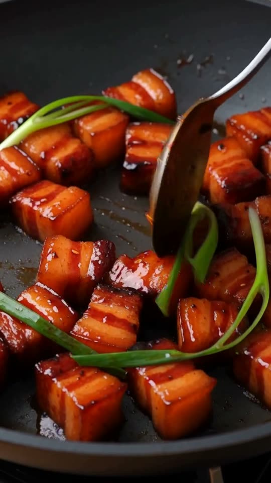 Step 6: Garnish & Serve: Remove from the heat, toss with 3 thinly sliced scallions, and scatter with 1 tbsp toasted white sesame