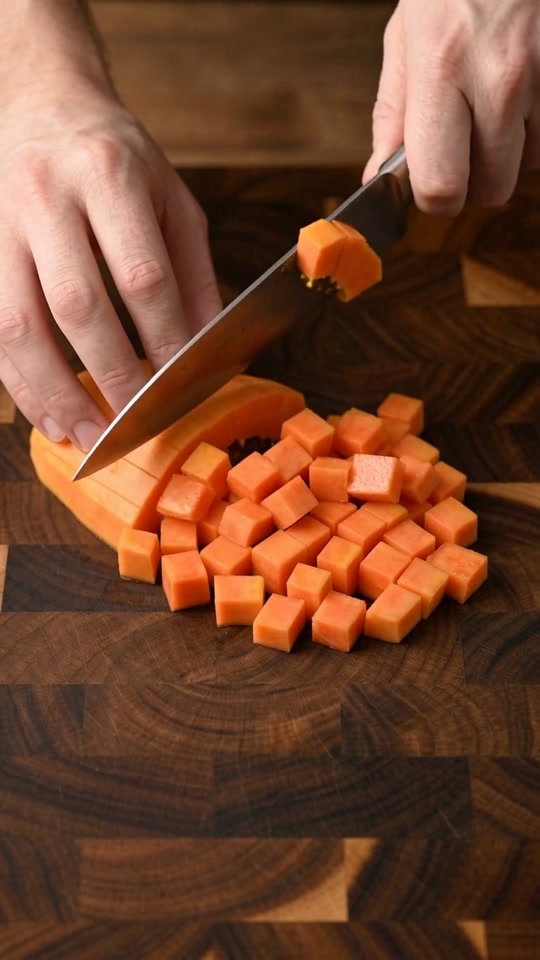 Step 3: Dice the Firm Orchard and Melon Base: On a spotless cutting board with a sharp chef's knife, peel and seed the papaya an