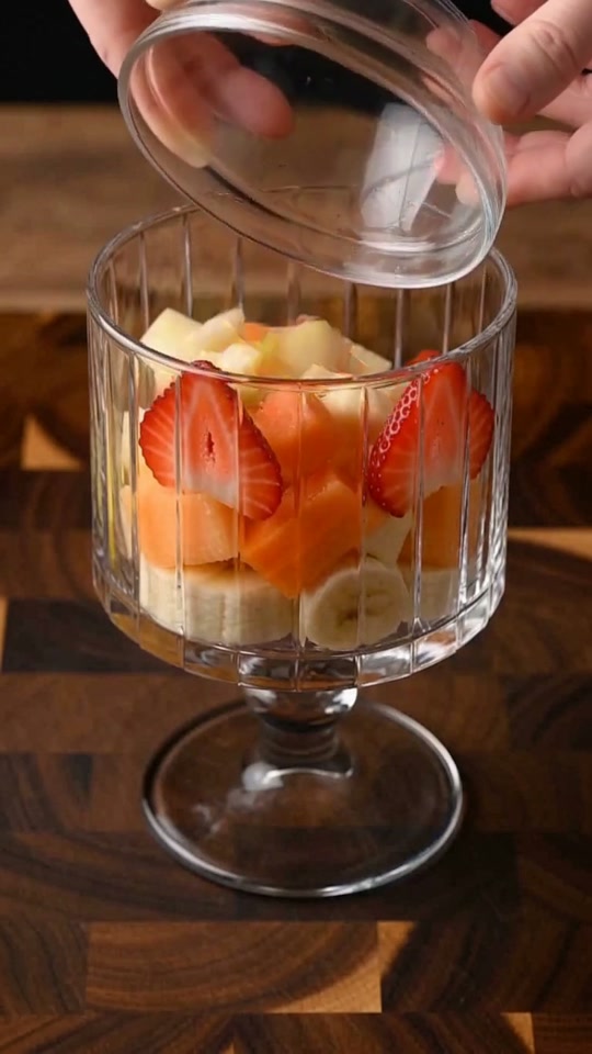 Step 5: Stack the Rainbow Fruit Tiers in Chilled Coupes: Arrange the diced cantaloupe, papaya, crisp red apple, banana coins, an