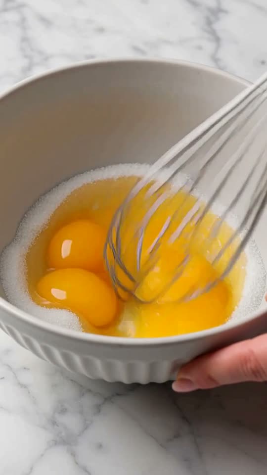 Step 2: Whisk the Yolks & Temper Slowly: In a medium bowl, whisk 5 large egg yolks and 70g (1/3 cup) caster sugar together gentl